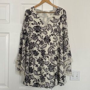 NWOT ASTR The Label mini dress with v-neck and statement sleeves.